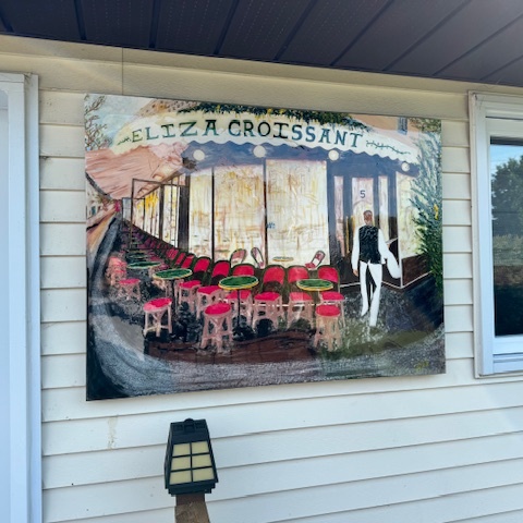 Eliza Croissant
Based on a photograph of a cafe in Paris. Poured resin over the painting so we could hang it outside year round.

Acrylic on canvas
36 x 48